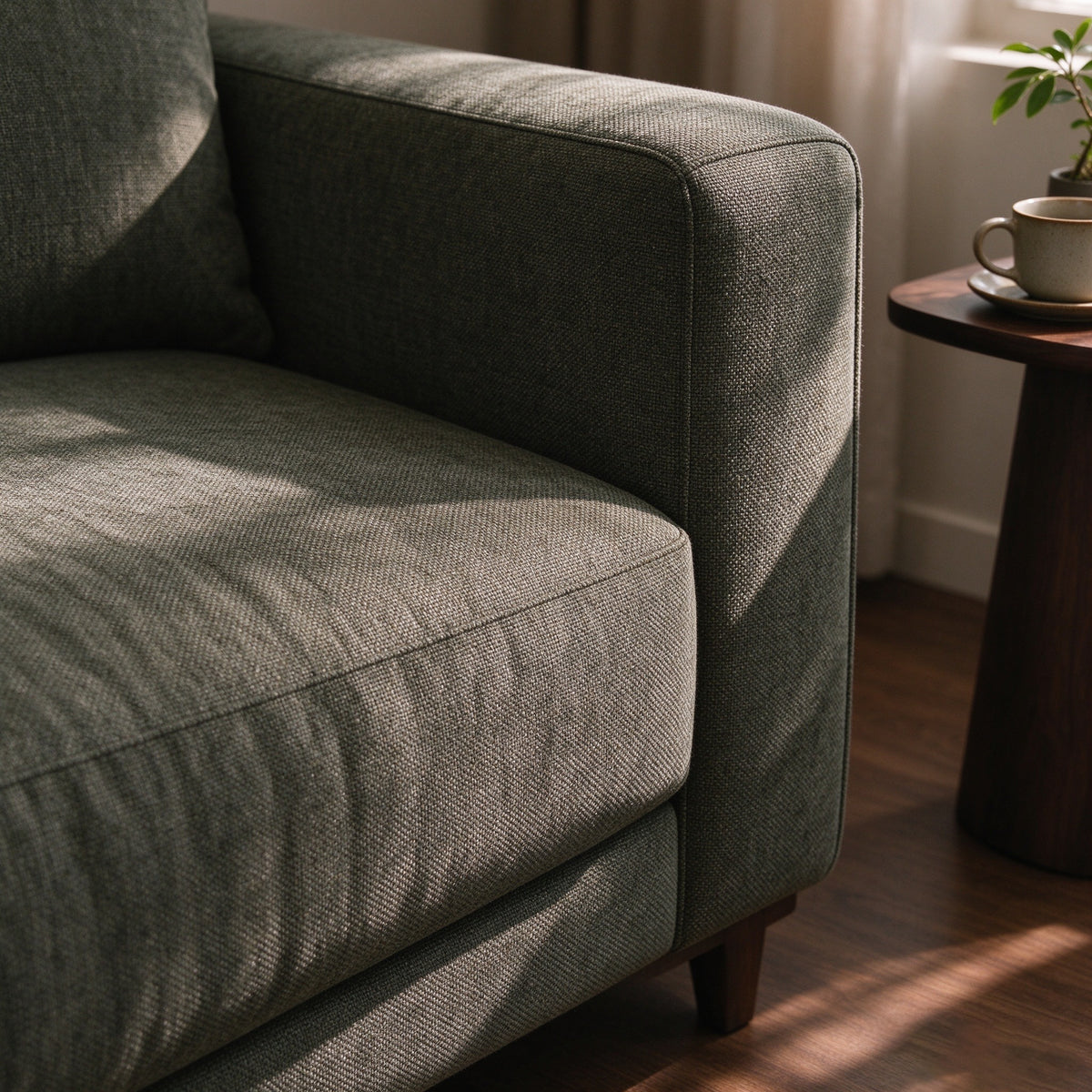 Close-up of the woven arm and cushion on the Ember sofa