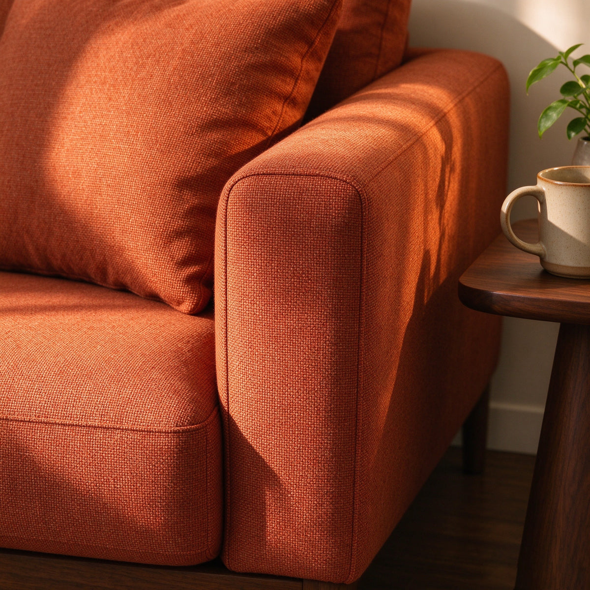 Close-up of the terracotta weave and squared arm of the Nomad sofa