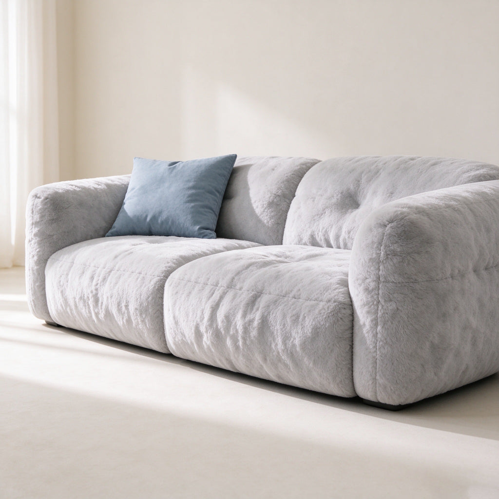 Russet sofa three-quarter view with a blue linen cushion